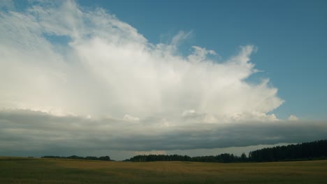 huge rain clouds cumulus stratocumulus time lapse over countryside fields