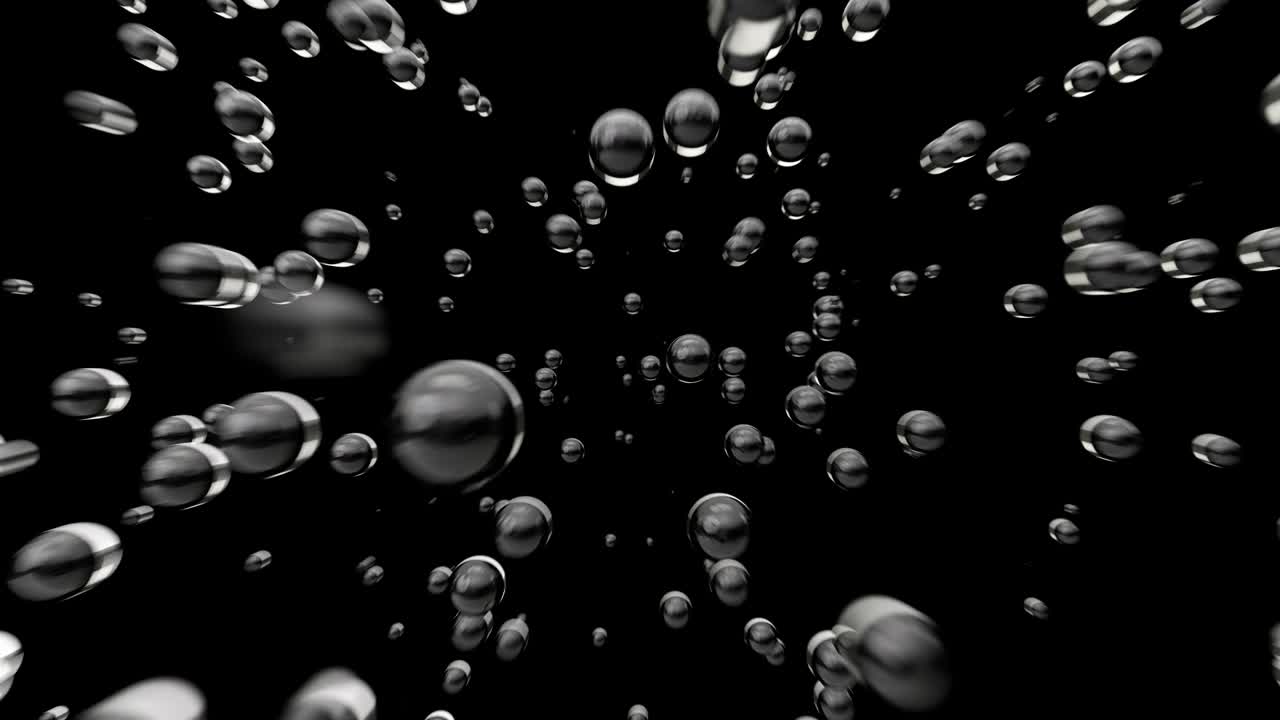 Fast flight through an underwater water cloud of bubbles on a black background. Bubble mass flow. Loop. 3d animation in 4K Ultra HD.