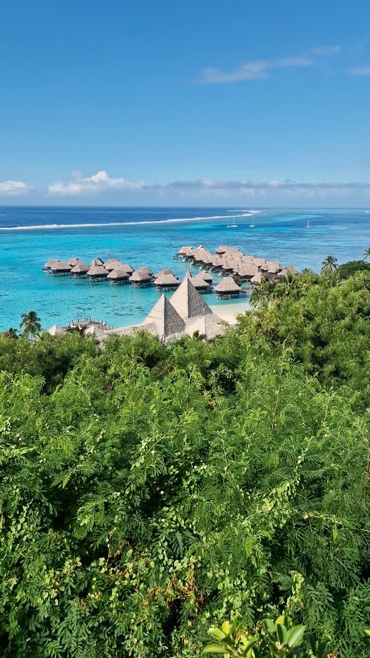 Vertical View of Luxury Tropical Retreat on Moorea Island, French Polynesia. Overwater Bungalows of Luxury Resort