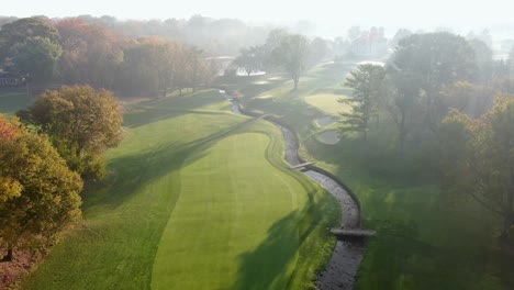 Aerial-flyover-tracks-stream-running-through-country-club-in-Lancaster-Pennsylvania