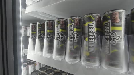 white rabbit energy drink cans in a refrigerated vending machine