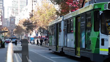 tram arriving at a melbourne city stop