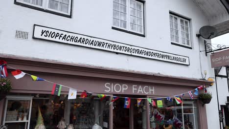 vibrant flags adorn a charming welsh shop