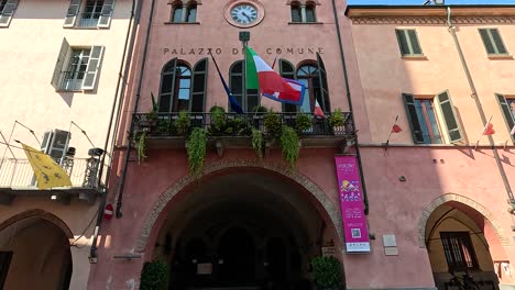 facade of historic building with flags