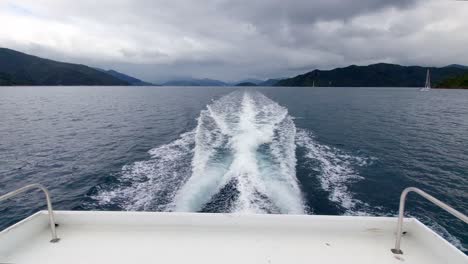 The-view-of-the-wake-of-a-small-ferry-as-it-sails-through-the-Marlborough-Sounds-in-the-South-Island-of-New-Zealand