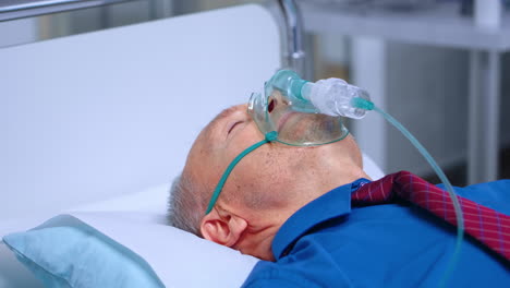 sick old man in respiratory mask