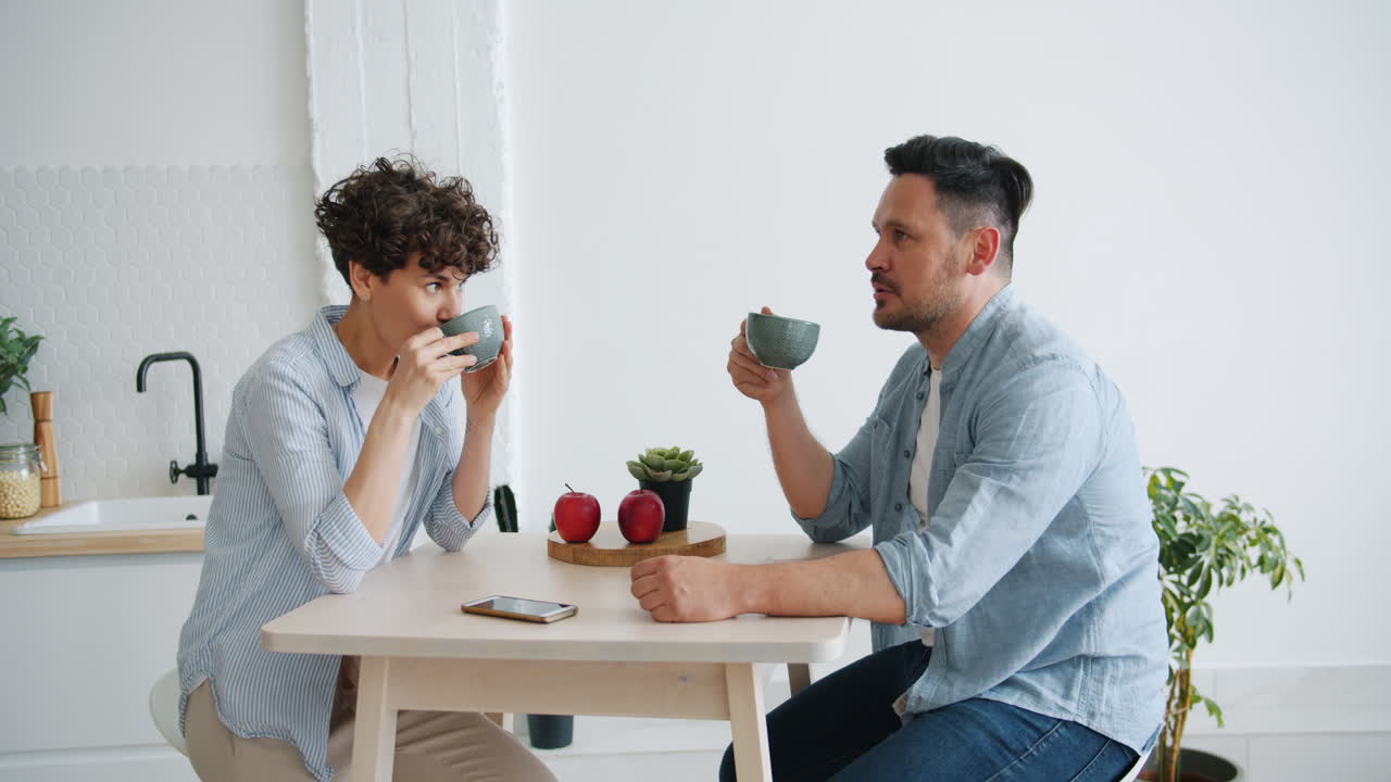 Couple having coffee in a kitchen