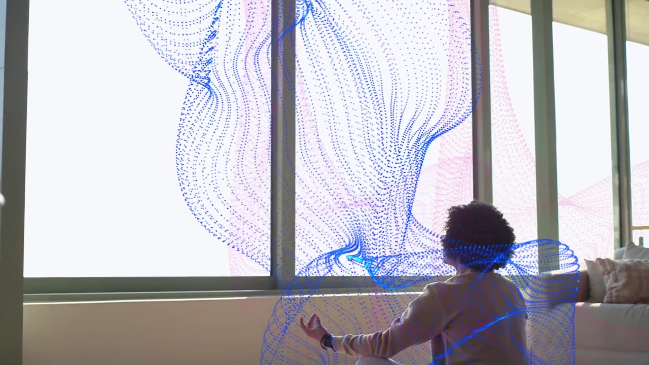 Adult male placing green panel by window and creating blue-pink ribbon, testing AR interaction