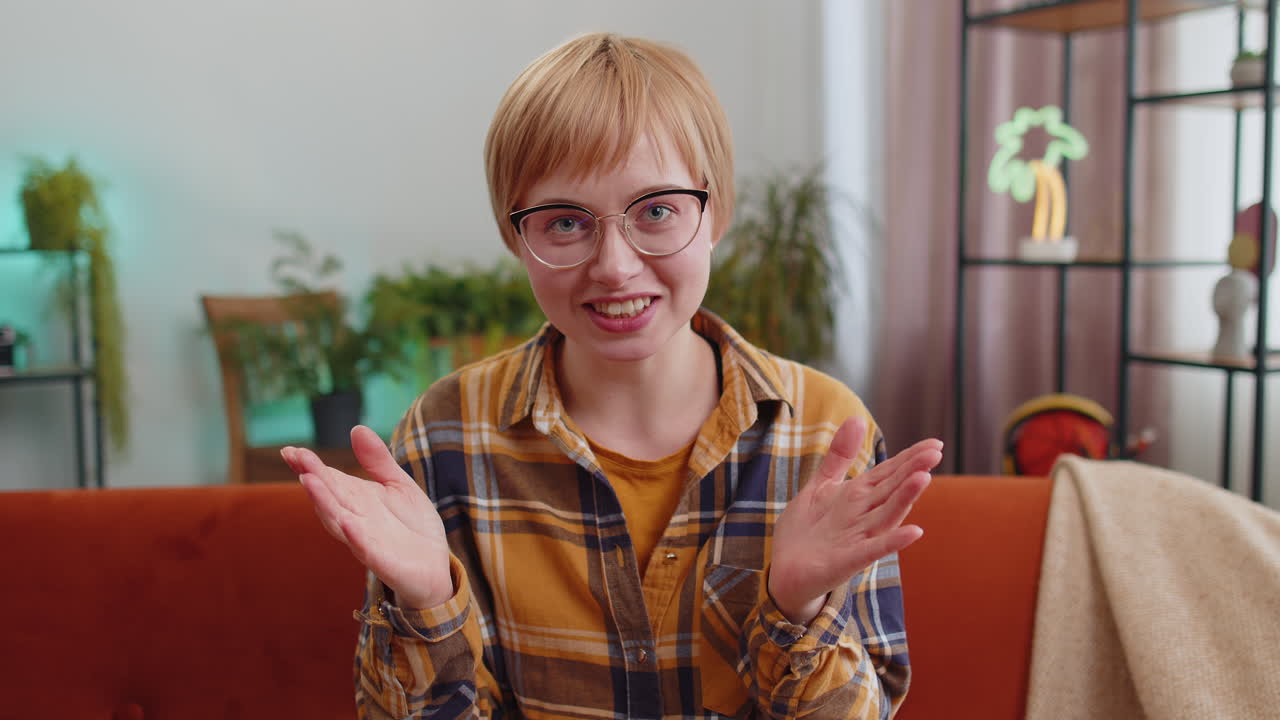 Pov of young woman looking at camera making selfie video webcam conference call with friends at home