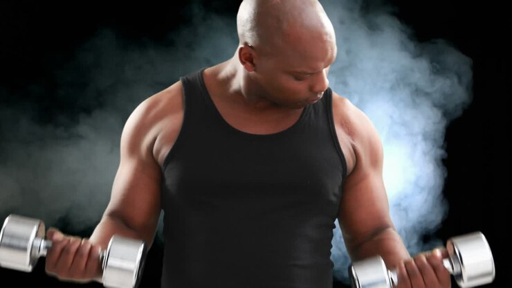 Bodybuilder lifting dumbbells