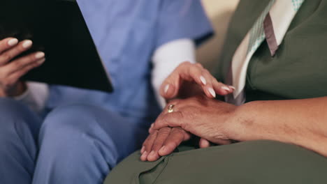 nurse comforting elderly patient