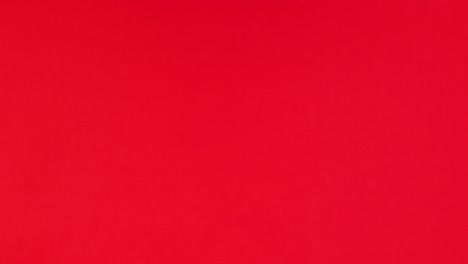 regalo, santa claus, copos de nieve y adornos aparecen en el lado izquierdo del tema rojo.