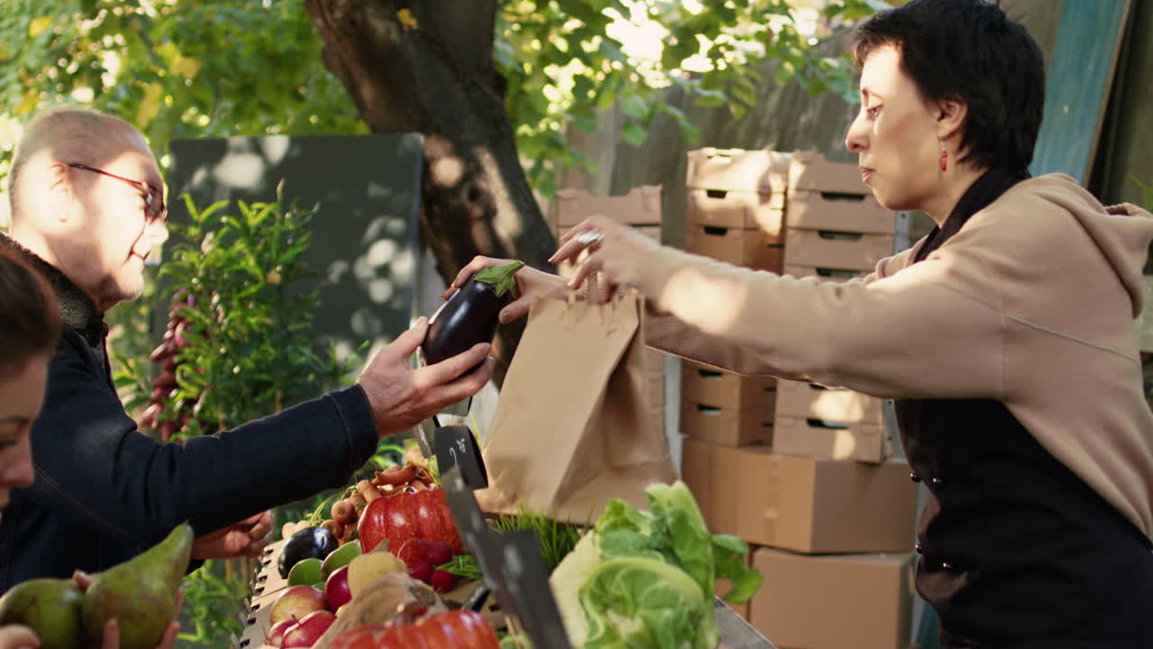 People buying vegetables at a market