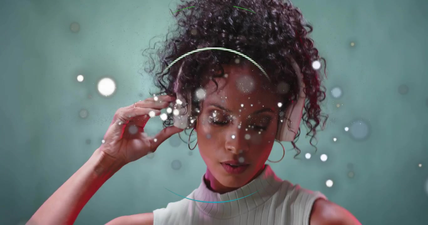 Turning model in ribbed top, white headphones adjusting cups in studio as ring appearing for demo