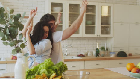 Young-lovers-dancing-and-having-fun-at-home