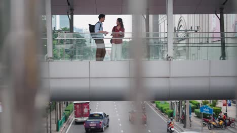 couple on a pedestrian bridge