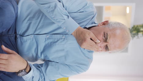 Vertical-video-of-The-old-man-who-smells-bad-odor-is-disturbed-and-disgusted.