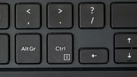 top view finger pressing alt gr and ctrl keyboard buttons