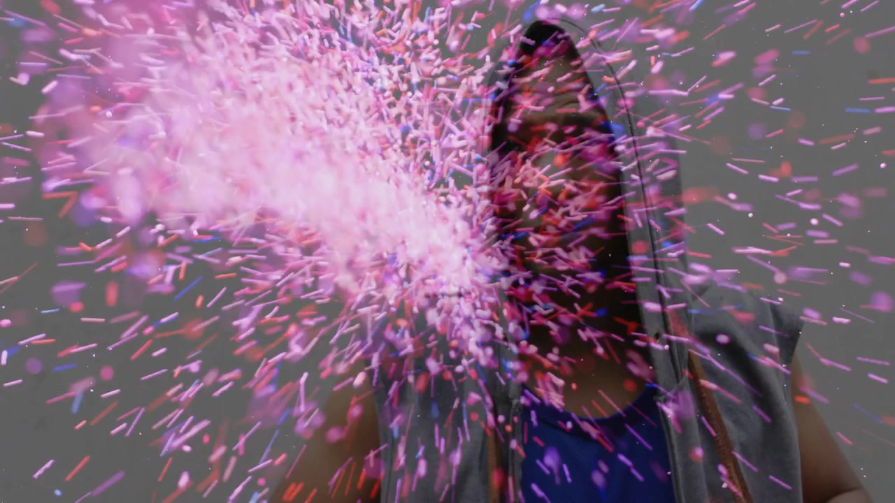 Man pulling cord raising hood in studio sparking magenta burst hiding then revealing face for ads