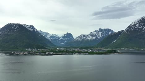 rising aerial unweiling beautiful city of andalsnes in norway during springtime