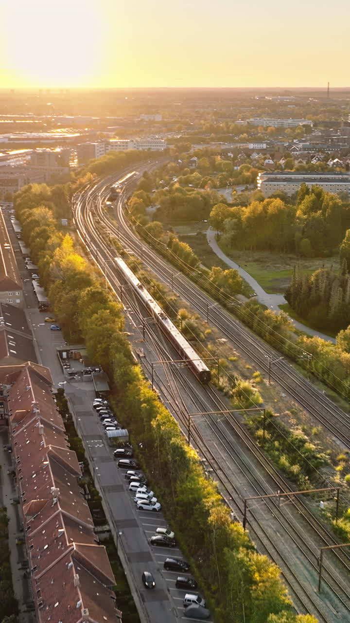 Aerial drone view of Vesterbro district in Copenhagen, Denmark at sunset. Vertical