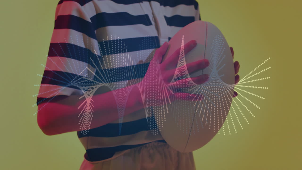 Holding rugby ball, person using digital animation for data visualization in school