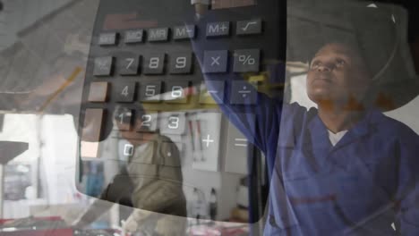 animation of calculator over african american mechanics