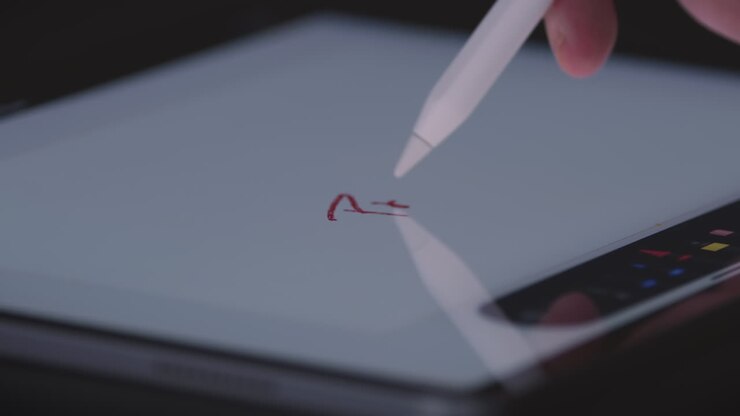 Writing on tablet screen with white stylus