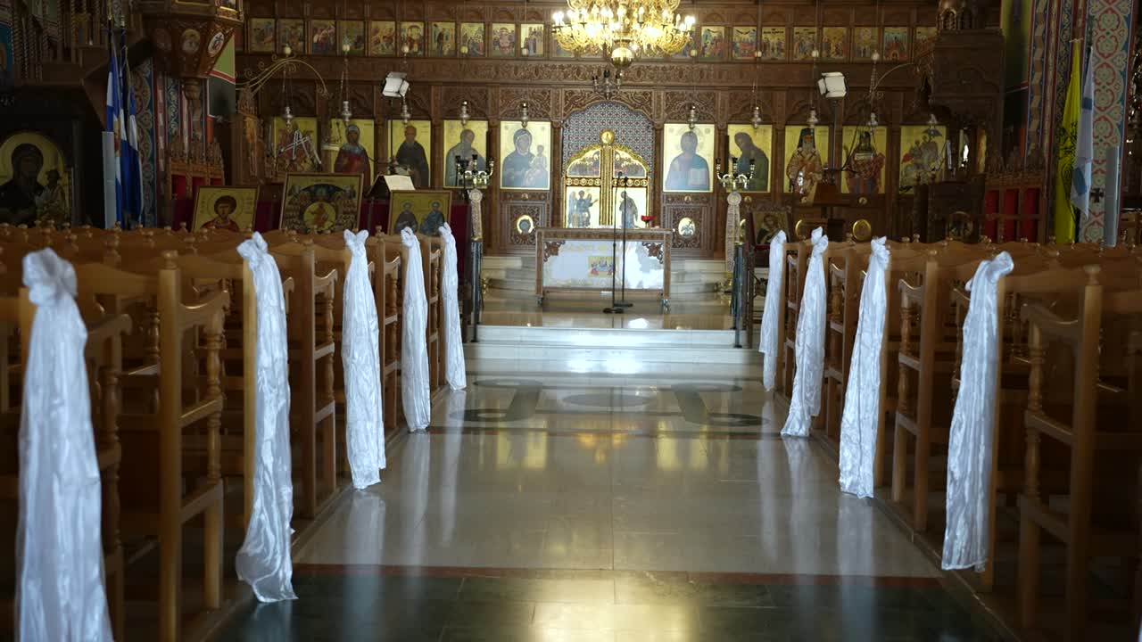 Serene interior of an ornate church with wooden pews and religious icons in a peaceful setting