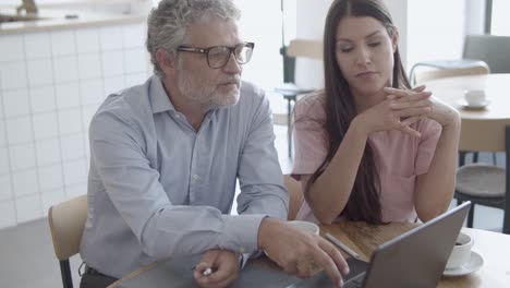 beautiful brunette female colleague talking with ceo