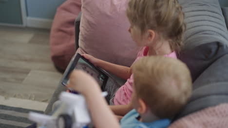 preschooler and toddler talk with grandma on video call