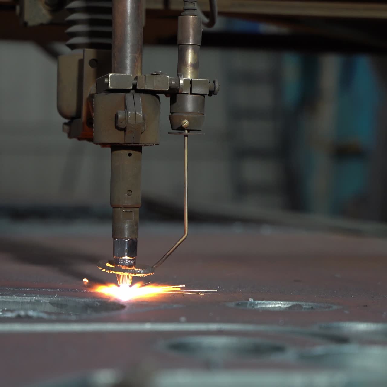 Laser plasma cutting of metal. Modern industrial technology. Industrial laser cutter with sparks. Close up