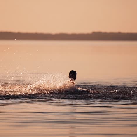 boy playing in river water