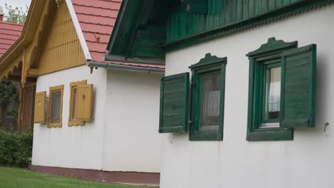 close-up of colorful window shutters on traditional village houses