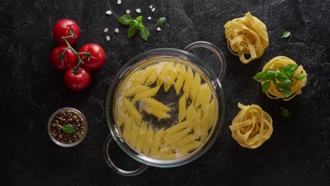 cinemagraph - cooking pasta in a glass pot with boiling water