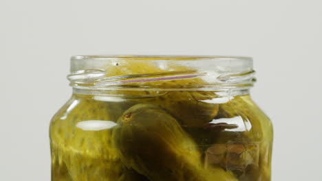 pickled cucumbers in a jar