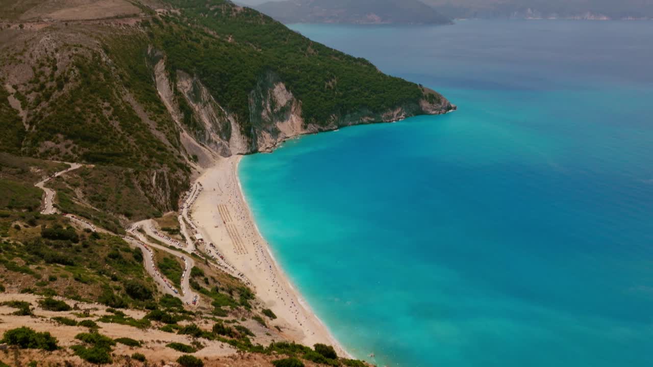 A cinematic aerial shot of Myrtos beach on the island Kefalonia in Greece
