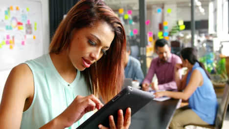 business executive using digital tablet in office