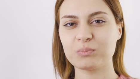 close-up portrait of woman eating turkish delight.