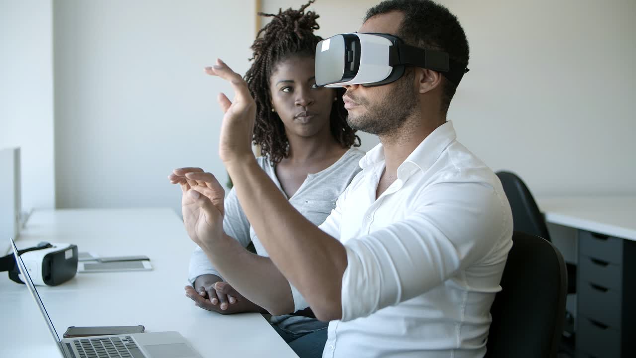 Focused workers testing new device.