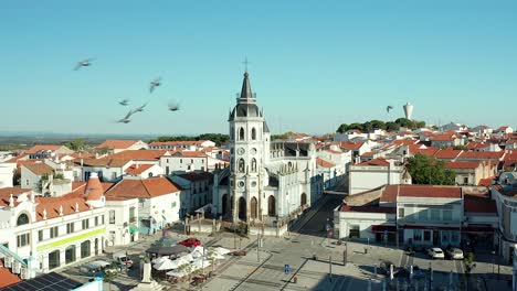 view of the center of reguengos portugal with the bell tower of church