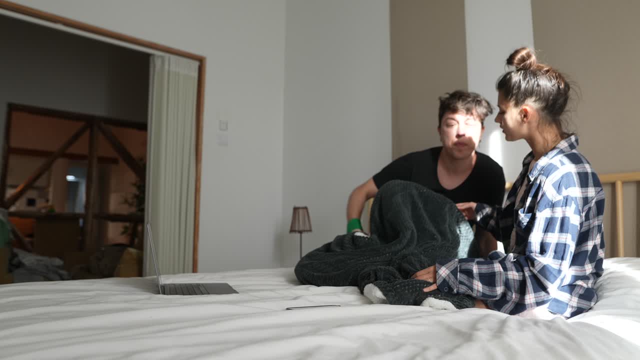 Couple Relaxing in Bed