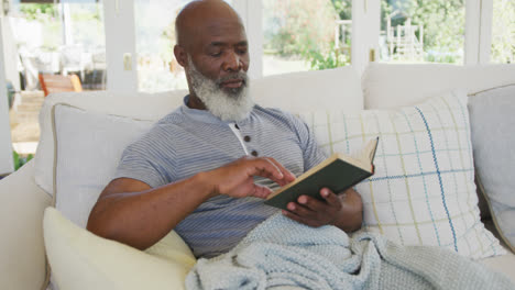 senior african american man reading book