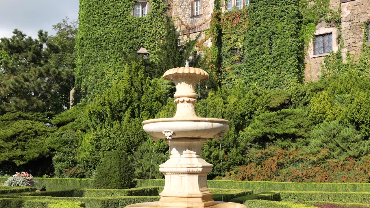 Decorative fountain in the majestic gardens of historic Ksiaz Castle, in Poland