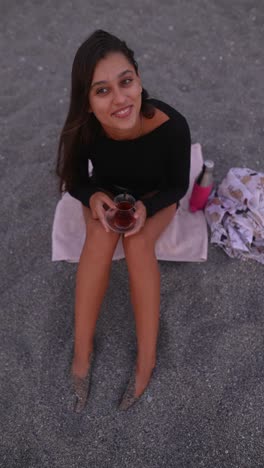 woman enjoying tea on the beach