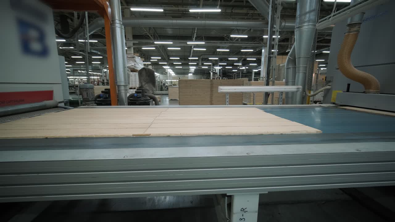 Wood Panels Moving on an Automated Conveyor Belt in a Factory