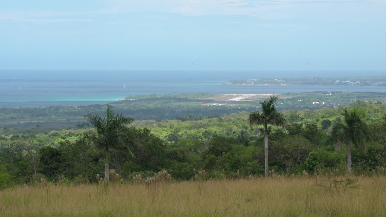 Static shot of the Puerto Plata Airport surrounded by the ocean and countryside