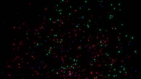 las partículas luminosas multicolores vuelan en diferentes direcciones y se disuelven contra un fondo oscuro. animación 3d