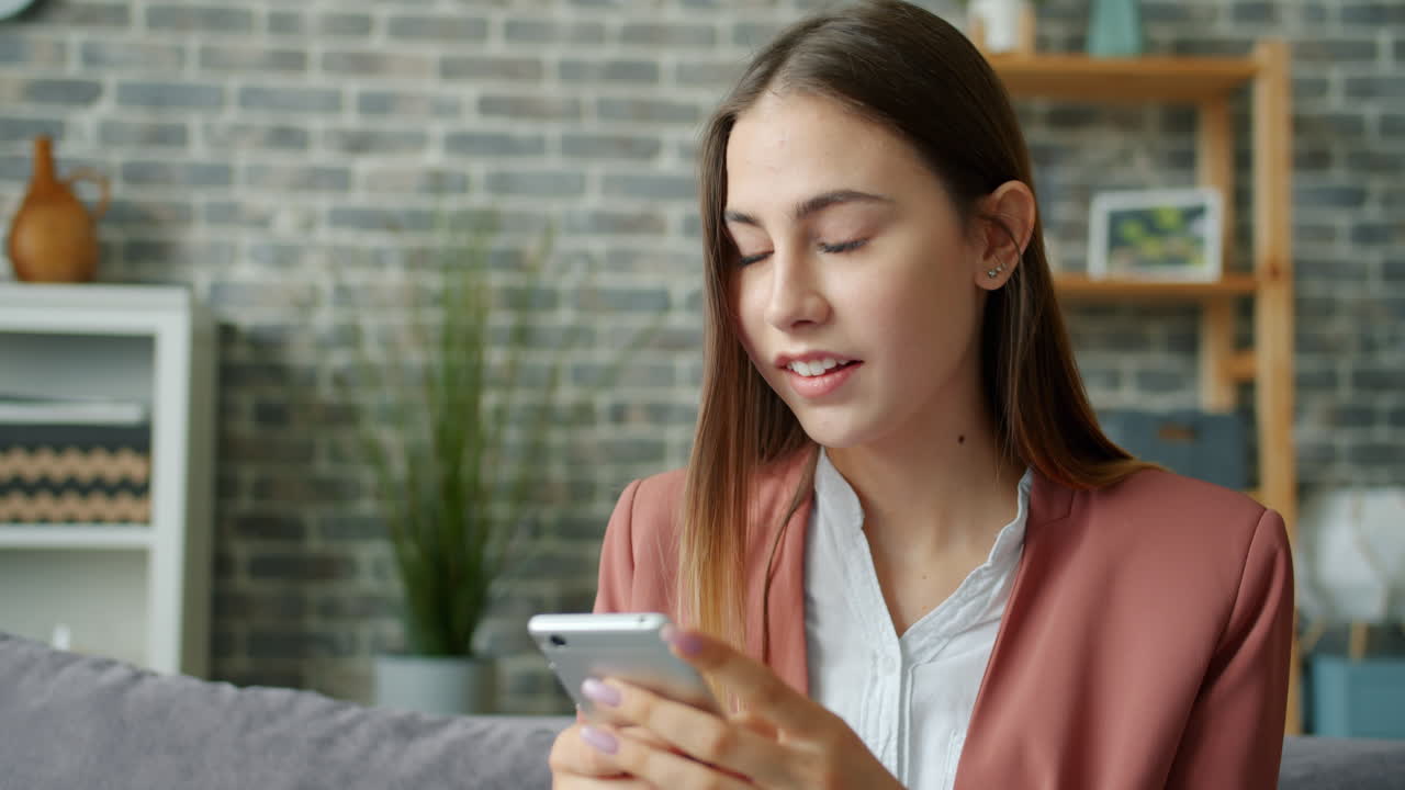 Young woman using a smartphone at home