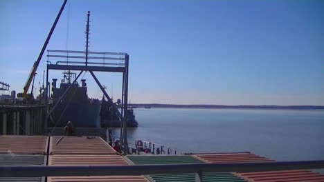 Time-Lapse-Of-A-Cargo-Ship-At-Sea-And-Docking-And-Unloading-1